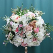 A Flower Arrangement With Roses
