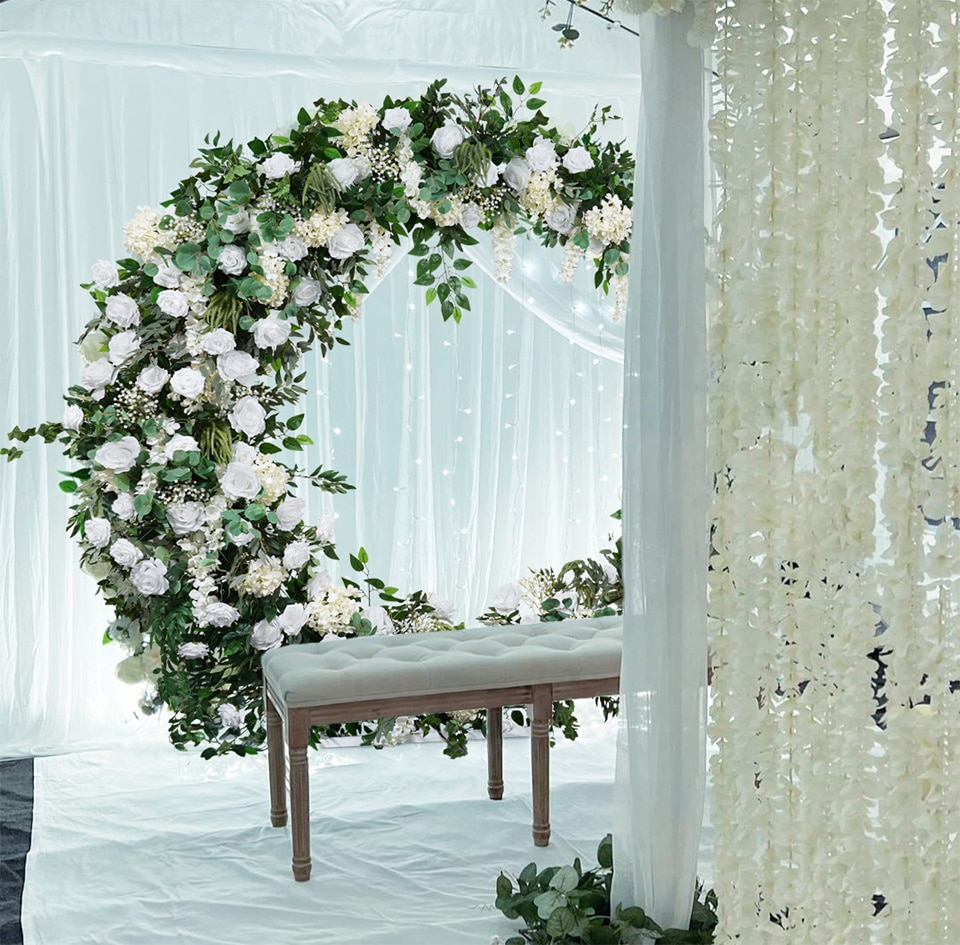 Fabric Backdrop: Using drapes or curtains for a romantic setting.